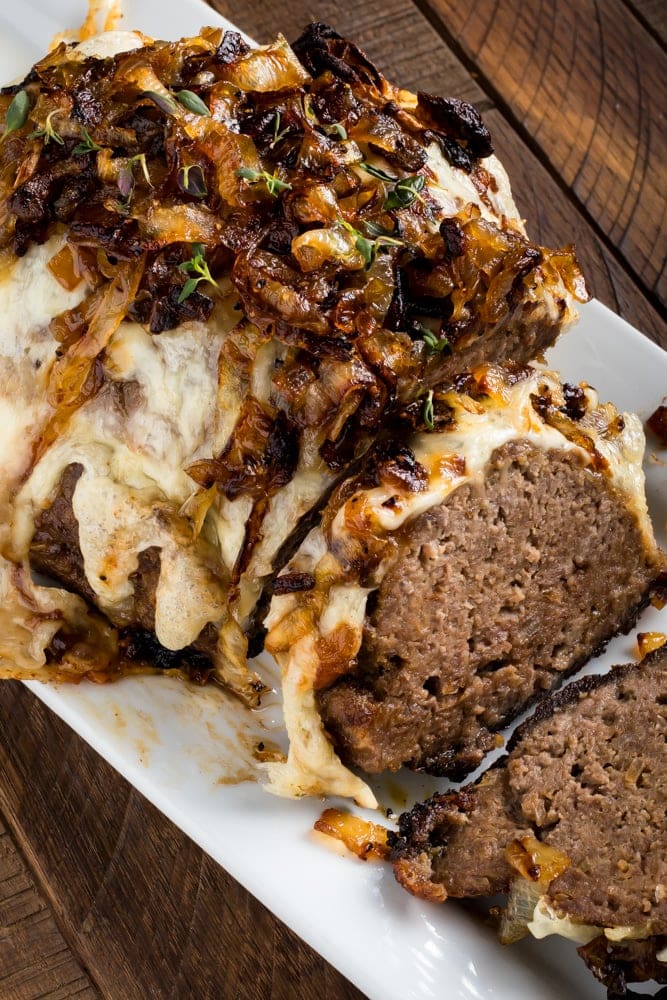 French Onion Meatloaf Recipe French onion meatloaf served on platter top sliced with cheese and caramelized onions on top