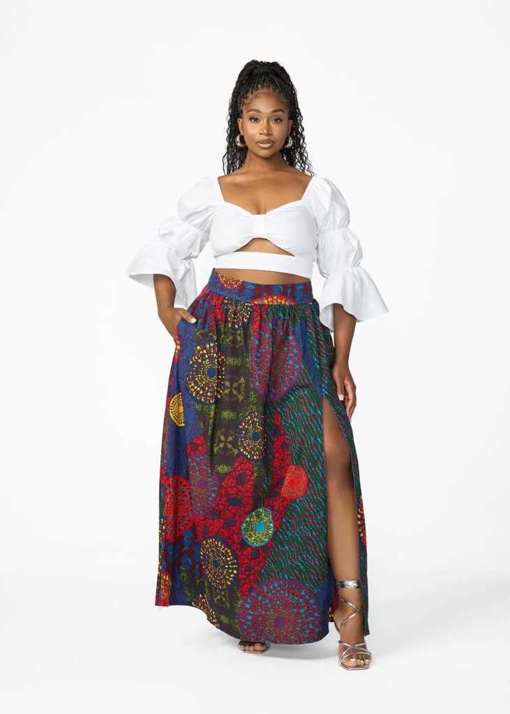 Two Pieces, Endless summer: Styling the Isioma Skirt and Ondina Kimono Front view of Isioma African print maxi skirt showcasing high side slit, adjustable sash waistband and pockets against white background