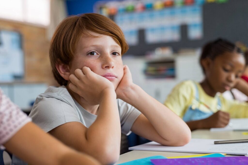 Less Interesting, Less Enjoyable: Why AI-Assisted Classes Feel Less Important Bored student in classroom