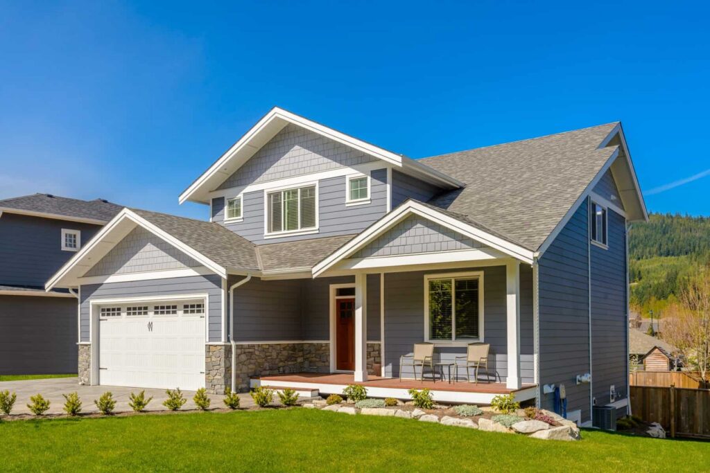 14 Essential Tips for First-Time Homebuyers A gray two-story house.