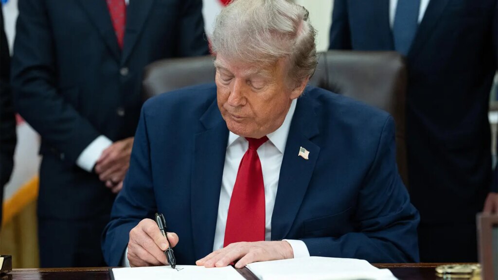 Trump Issues Controversial Order on Vaccines, Suggests Autism Link A photo of Trump signing an Executive Order in the Oval Office.