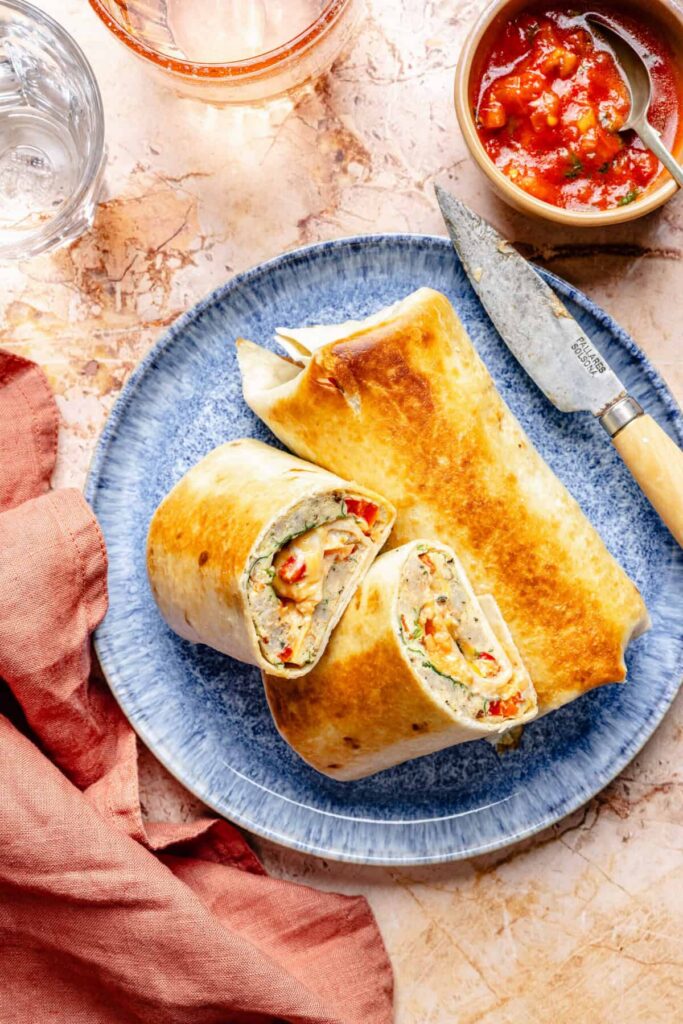 Sheet Pan Breakfast Burritos – All the Healthy Things sheet pan breakfast burritos on a plate with a knife