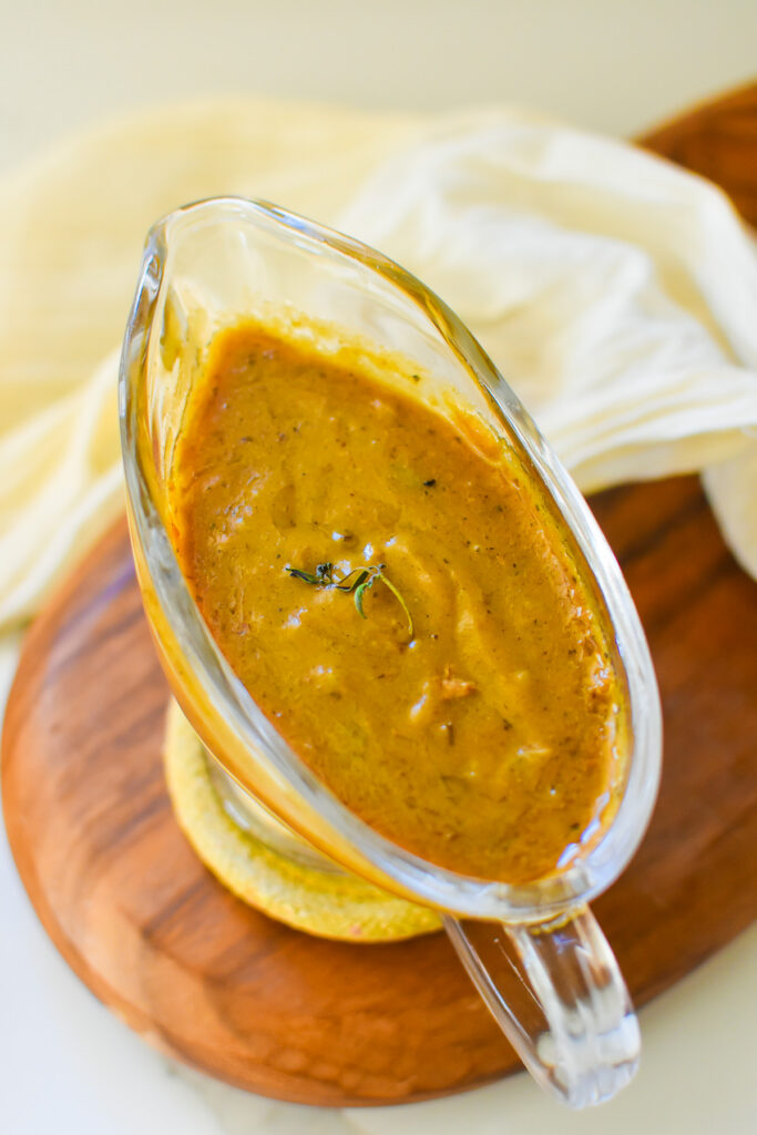 Southern Turkey Neck and Giblet Gravy the best old school turkey neck and giblet gravy without drippings served in a clear glass gravy boat.