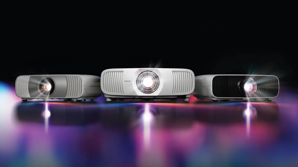 Epson Expands Its Home Theater Projector Line The 3 new Epson projectors on a shiny background.
