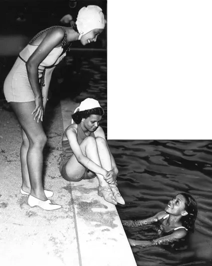 Des Moines Pools: A Look at History Amid Budget Cuts Three women in vintage swimsuits, two standing on the poolside and one sitting on the edge, smiling and engaging with each other, while one woman is in the water.