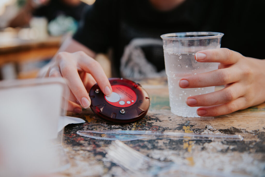 I miss the restaurant pager Customer holds restaurant pager (Catherine Falls / Getty Images)